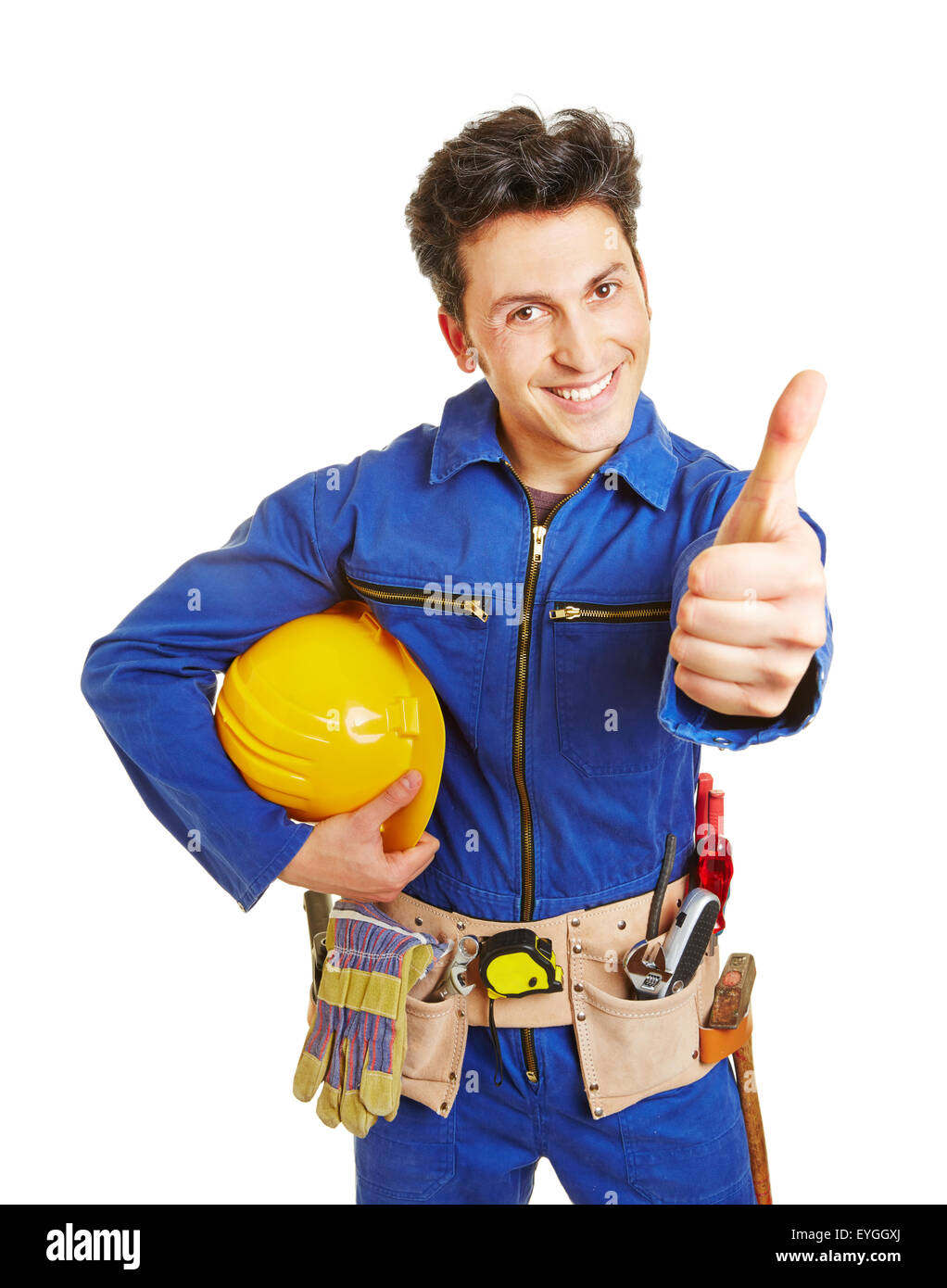 Glückliche Arbeiter mit Bauarbeiterhelm und Werkzeug Gürtel seine Daumen hochhalten Stockfoto
