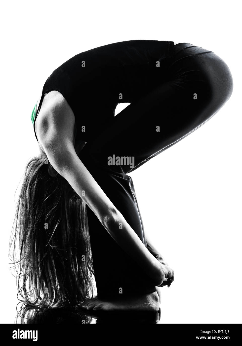 eine Frau Tänzerin dehnen Aufwärmübungen Studio Silhouette isoliert auf weißem Hintergrund Stockfoto