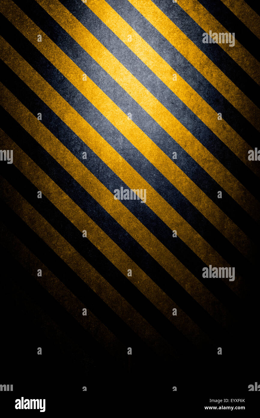 Texturierte Gefahr Hintergrund mit schwarz und gelb abgewinkelt Linien Stockfoto