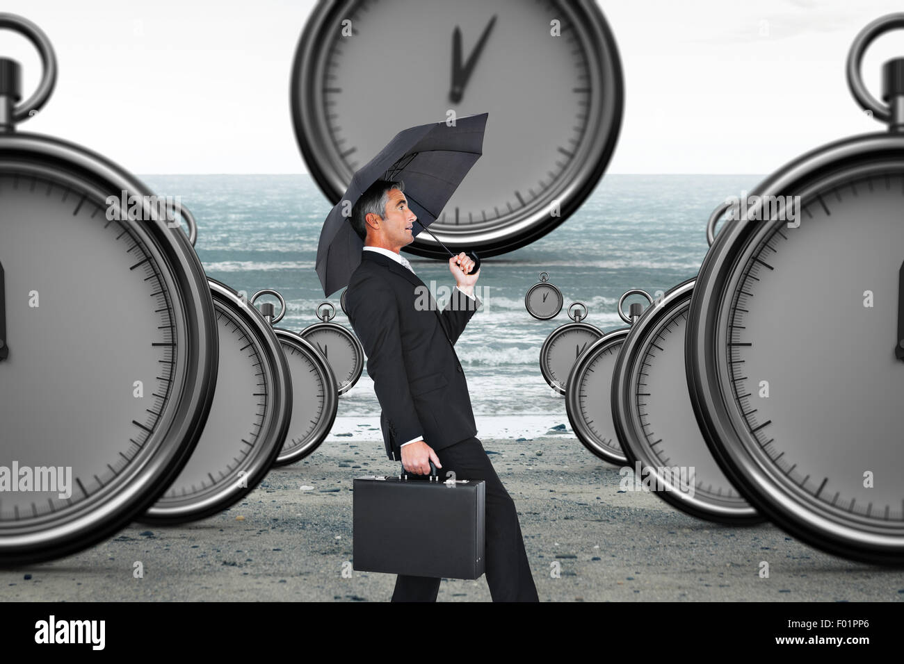 Zusammengesetztes Bild des Kaufmanns treibt des Windes mit Regenschirm Stockfoto