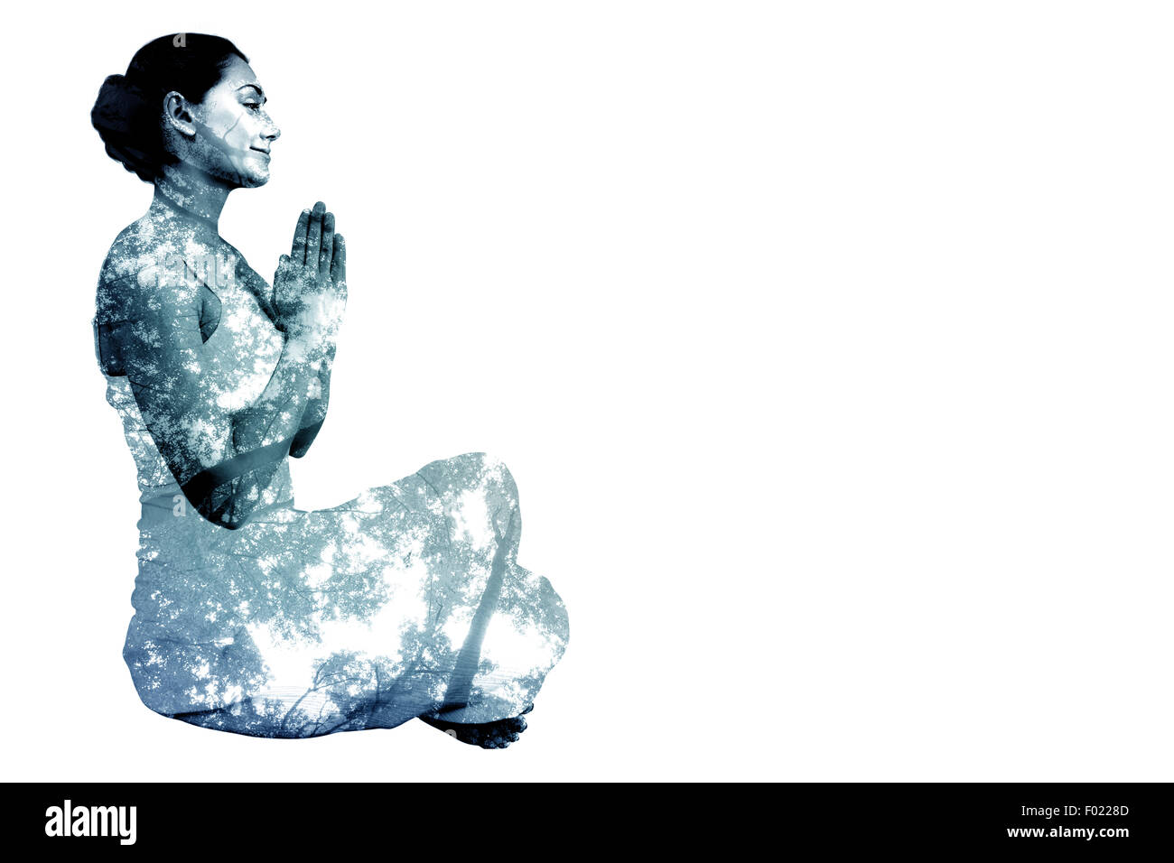 Zusammengesetztes Bild Inhalt Brünette in weißen sitzen in Lotus-pose Stockfoto