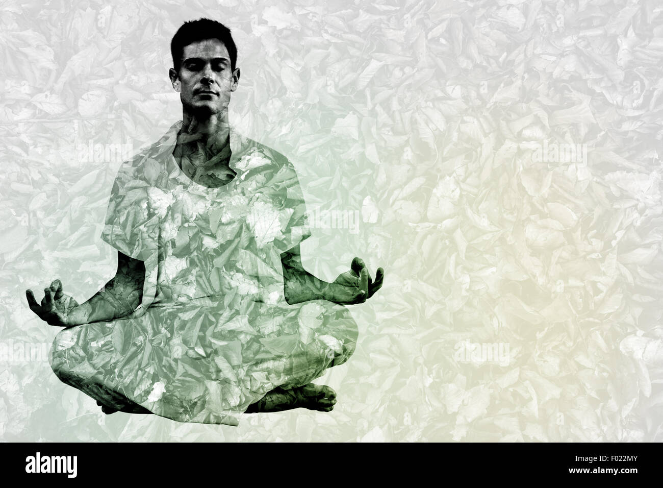 Zusammengesetztes Bild gut aussehender Mann im weißen meditieren im Lotus pose Stockfoto