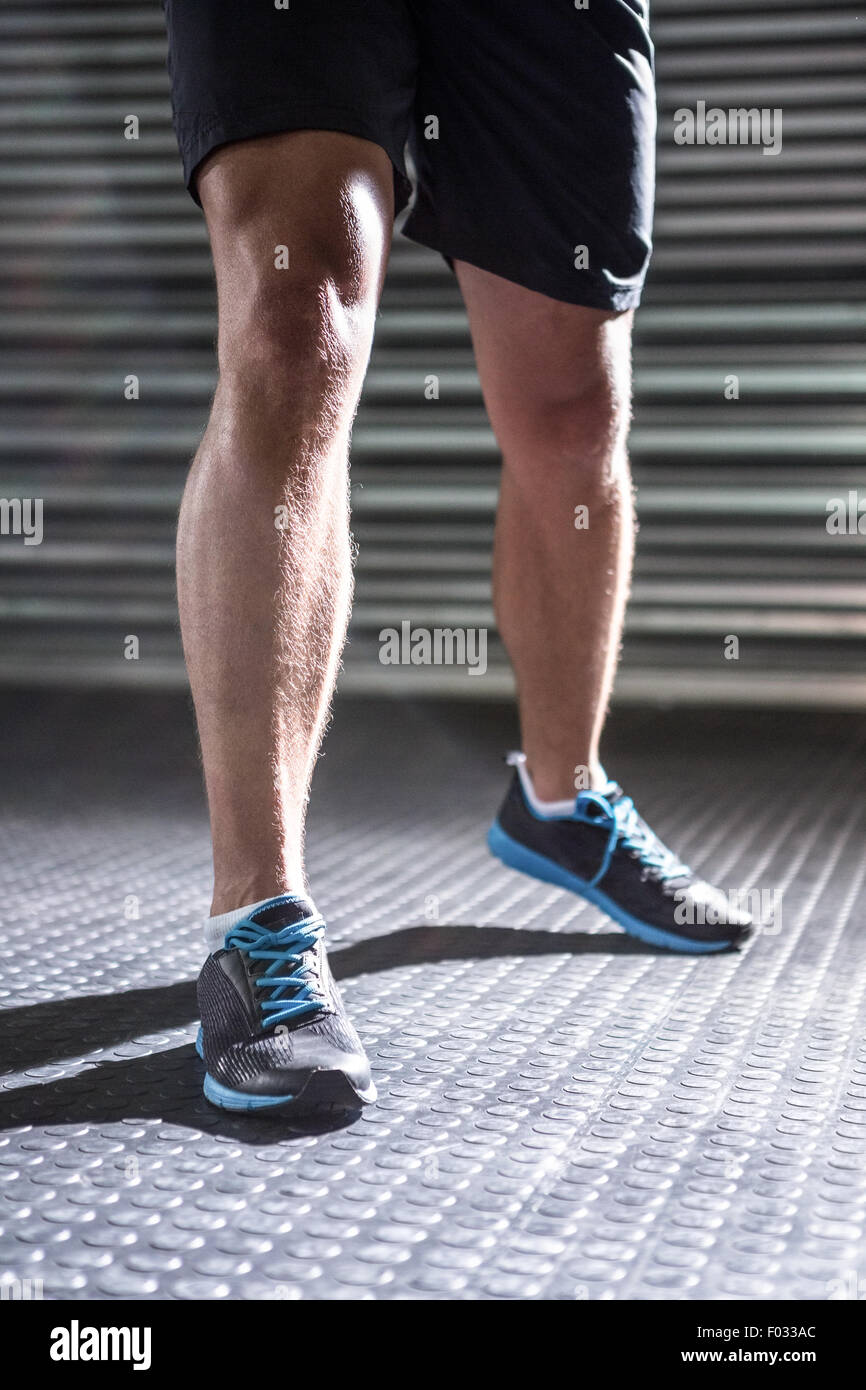 Muskulöse männliche Beine Stockfoto