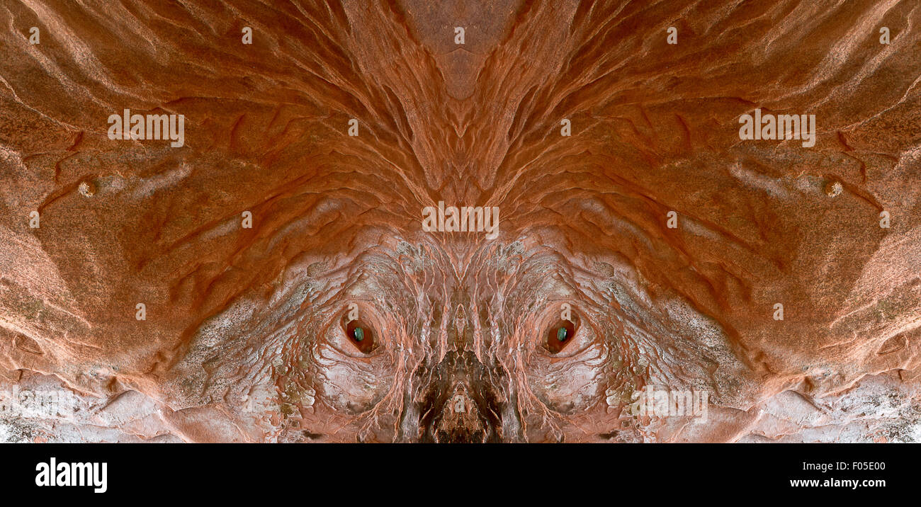 Alien Gesicht an der Wand aus Sandstein. Stockfoto