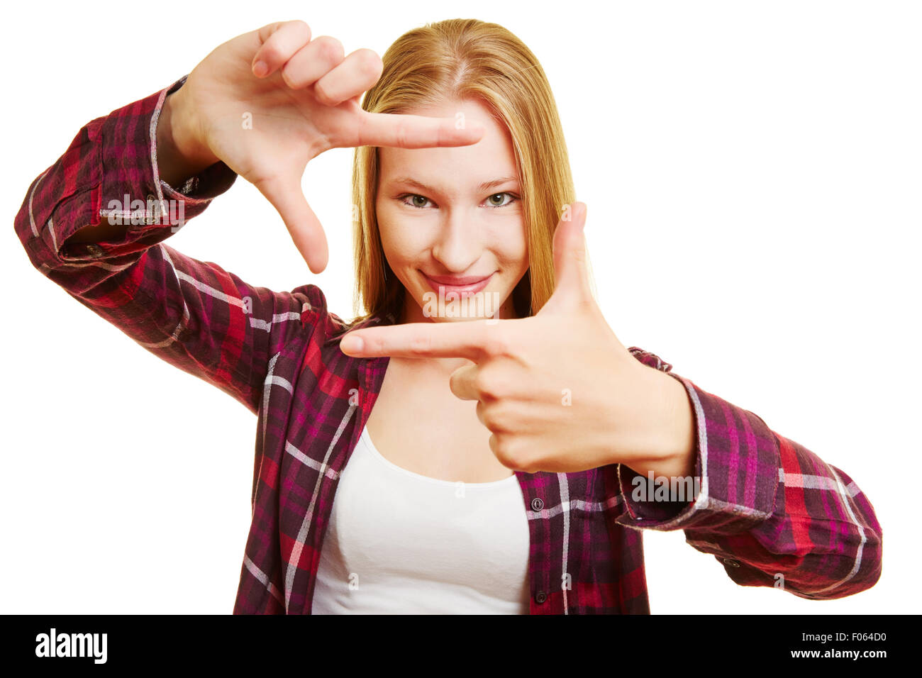 Junge Frau macht-Frame mit ihren Fingern vor ihr Gesicht Stockfoto