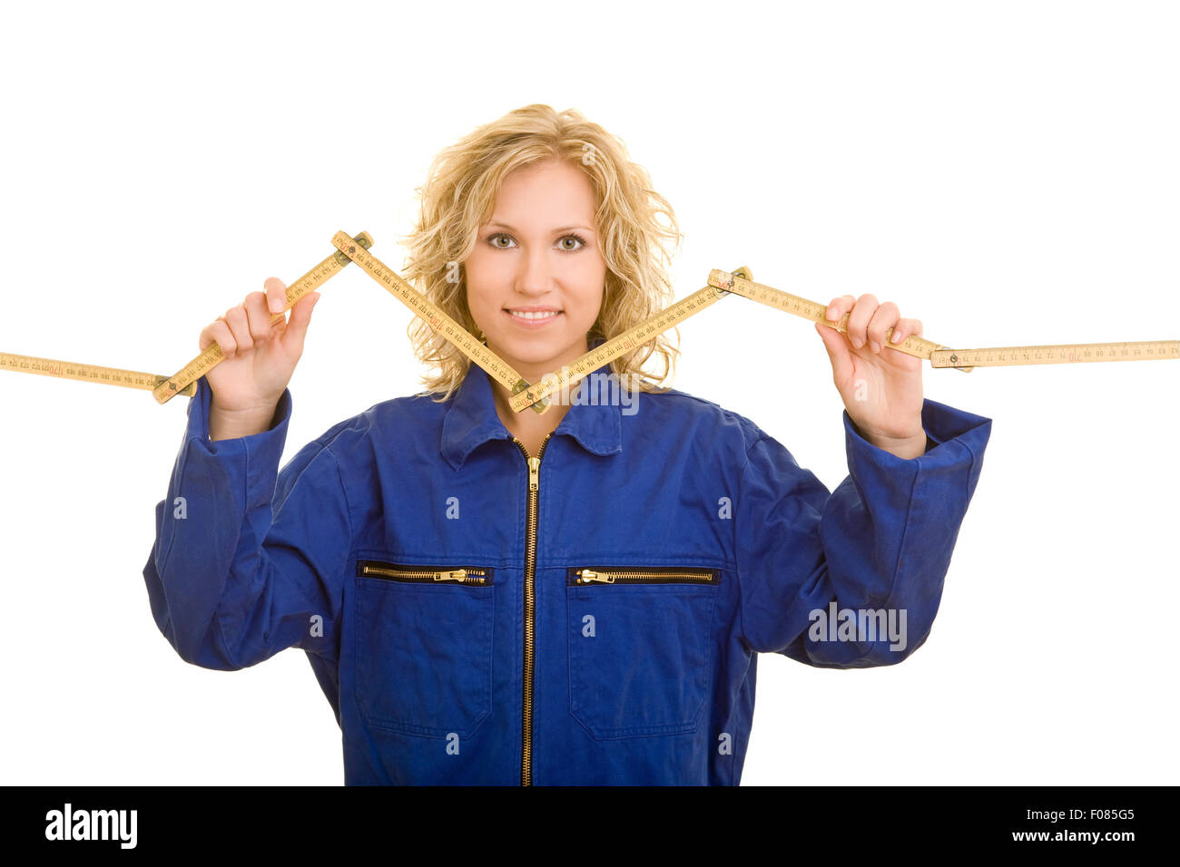 Weibliche Arbeiterin mit einem Zollstock Stockfoto