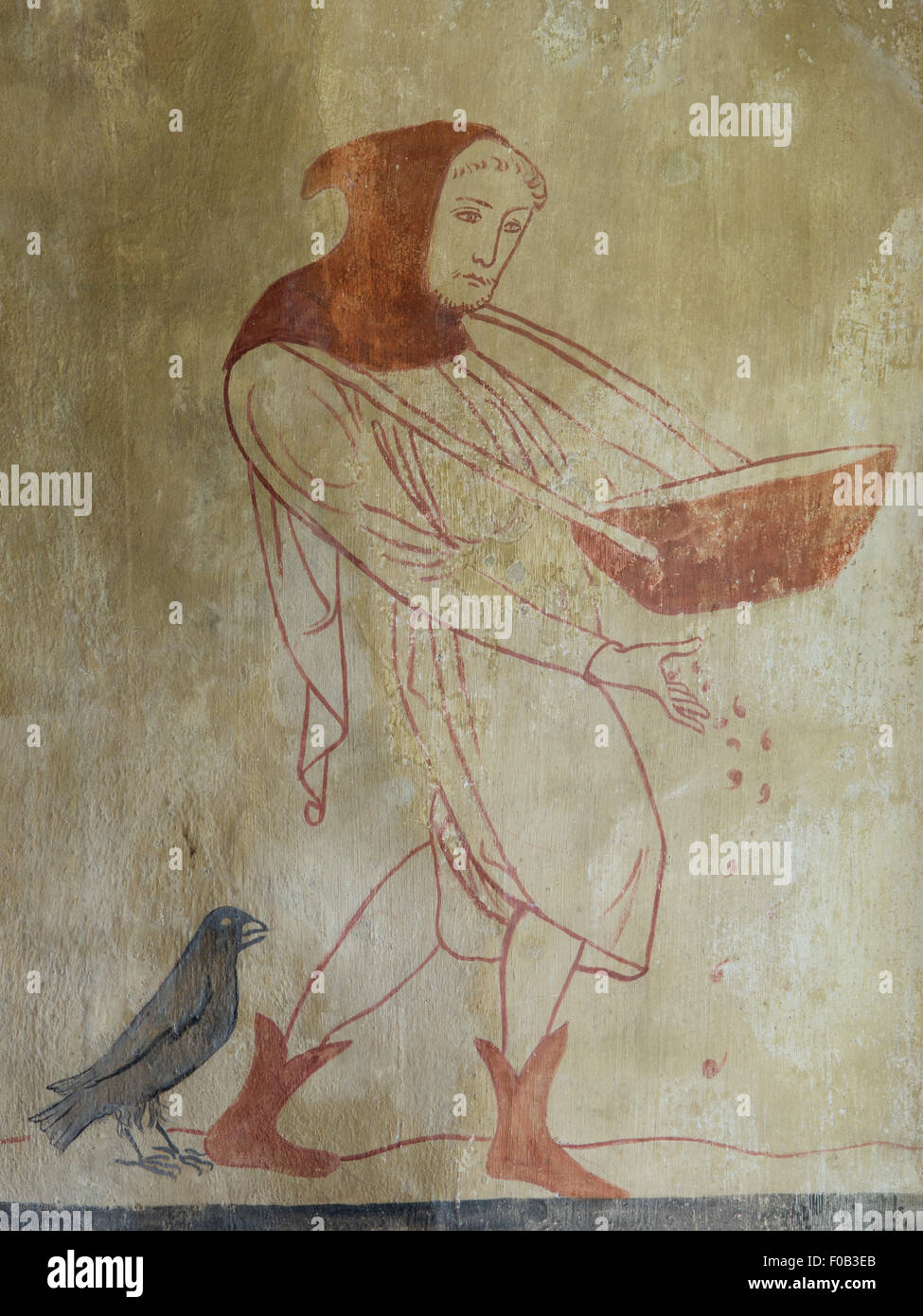 Ein Landarbeiter, säen, wie dargestellt in einer mittelalterlichen Wandmalerei in Easby Kirche, Richmond, North Yorkshire, Großbritannien Stockfoto