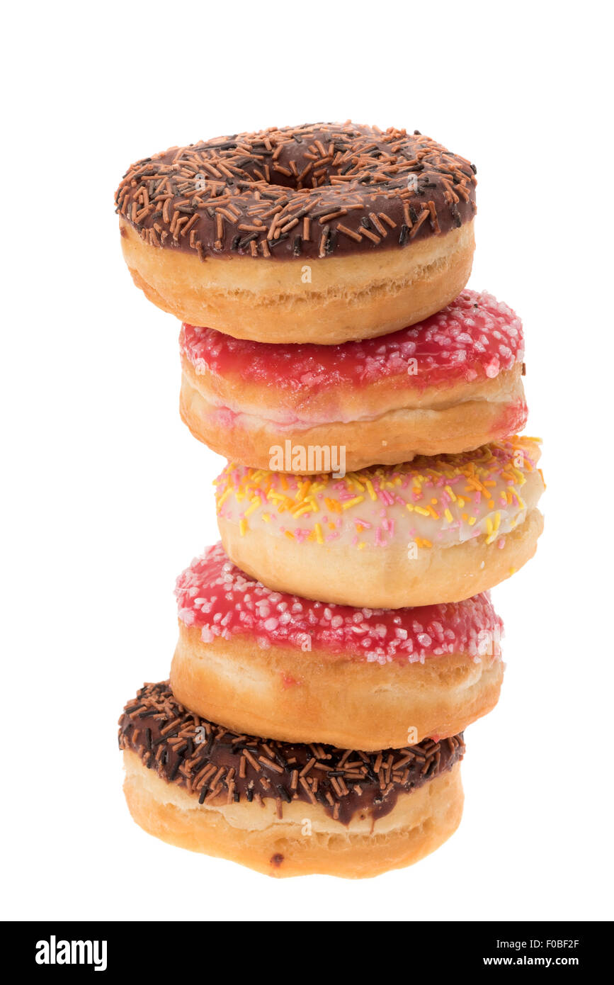 Stapel von glasiert und dekoriert Donuts - weißer Hintergrund Stockfoto