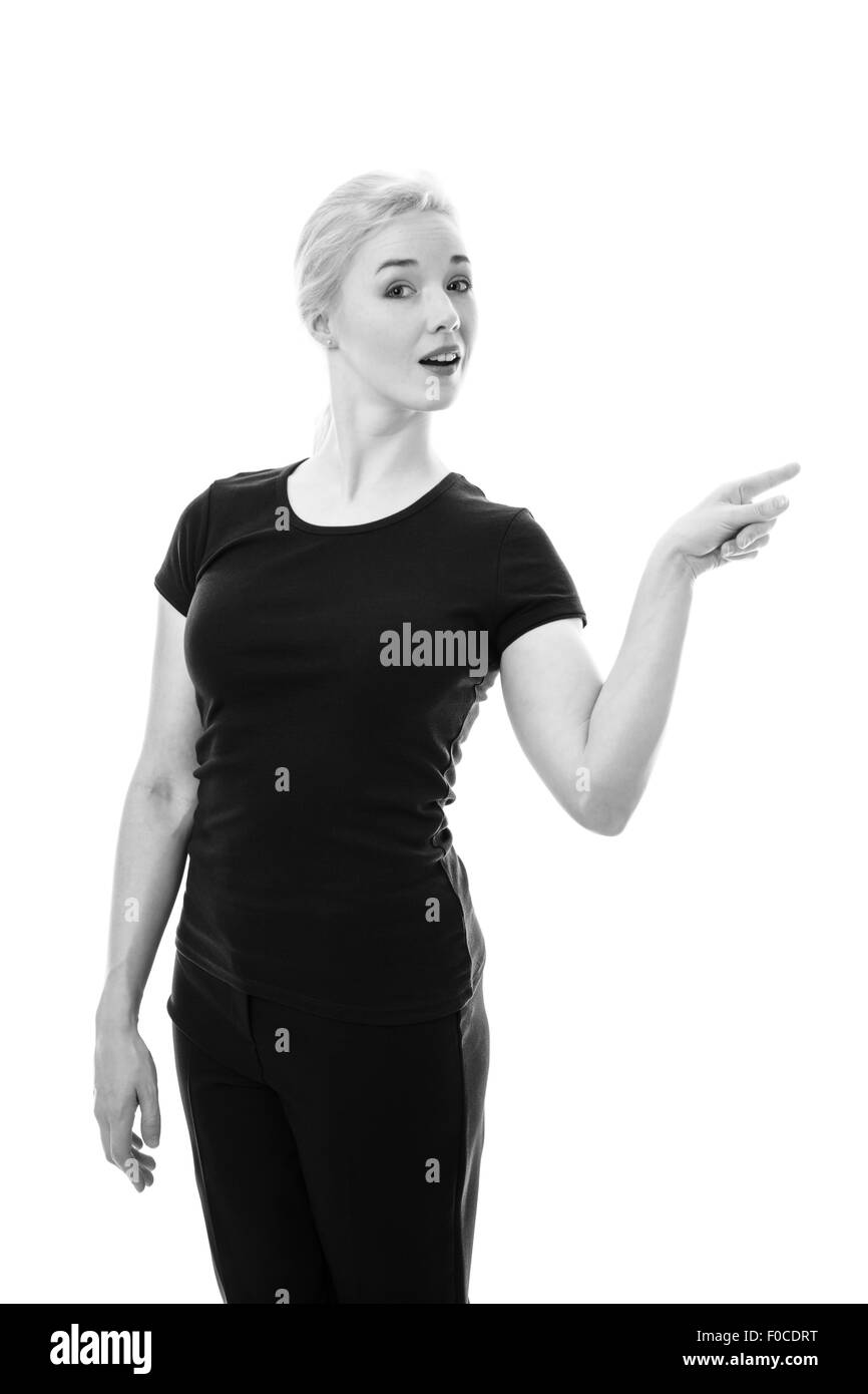 glückliche Frau zeigt Ihnen etwas auf die Seite Ihres Stockfoto