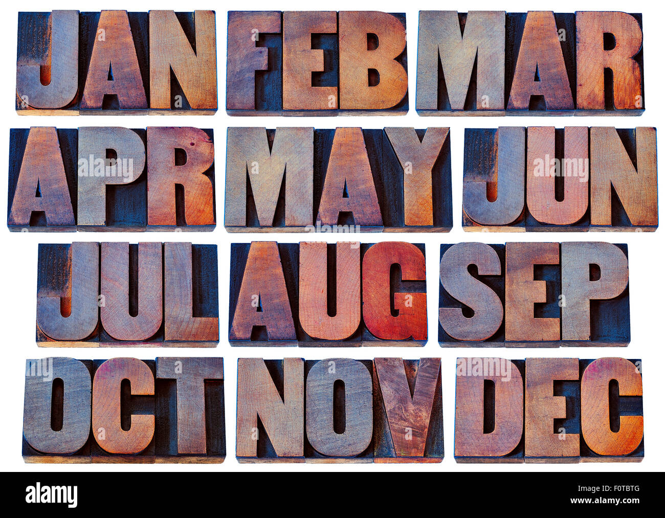 12 Monate von Januar bis Dezember - in eine Collage aus isolierten 3-Buchstaben-Symbole im Grunge Buchdruck Holzart Blöcke von gebeizt Stockfoto
