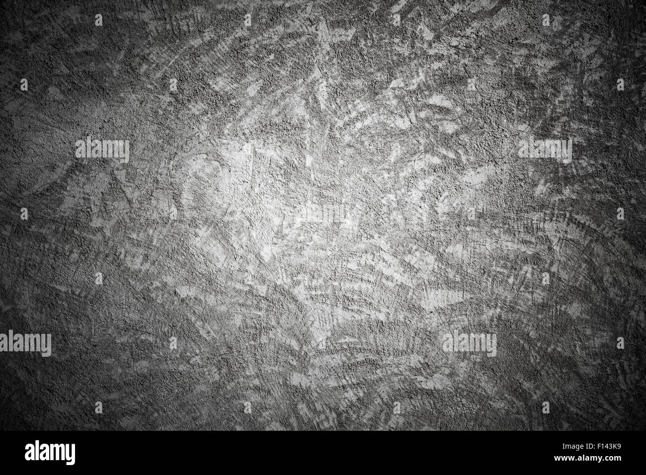 Closeup dunkle Betonwand Textur mit Gips Muster und Vignette Reliefeffekt Stockfoto