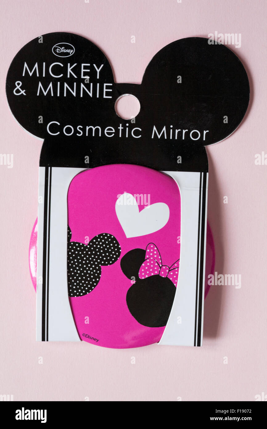 Disney Mickey & Minnie Kosmetikspiegel auf blass rosa Hintergrund isoliert Stockfoto