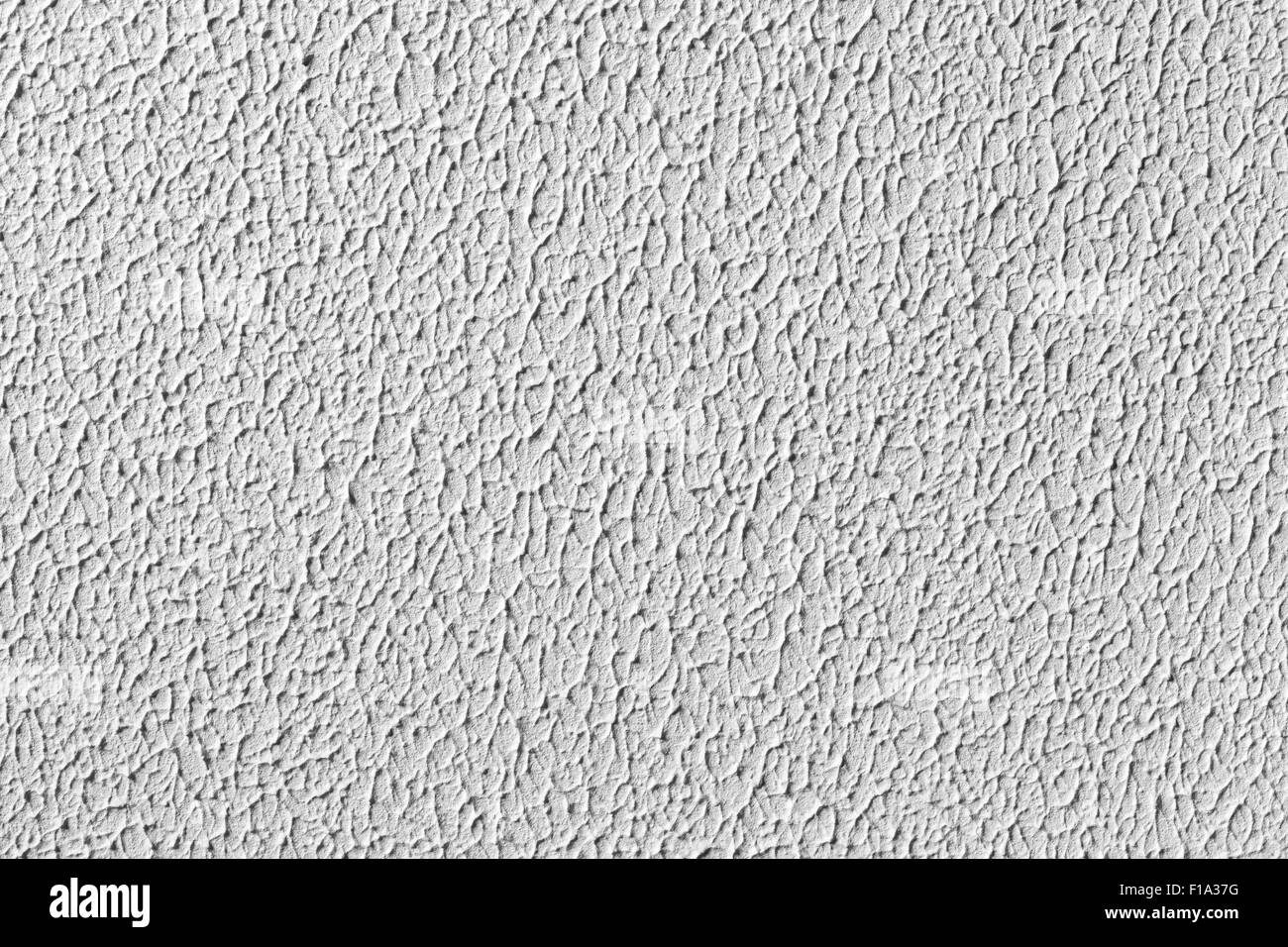 Weiße Wand mit Gips Reliefmuster. Hintergrundtextur Foto Stockfoto