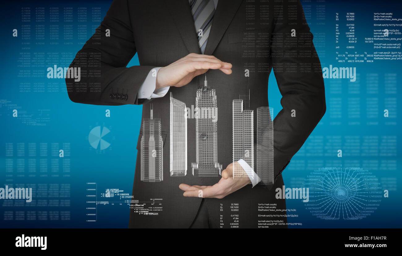 Geschäftsmann mit 3D-Modell der Stadt und Grafiken Stockfoto