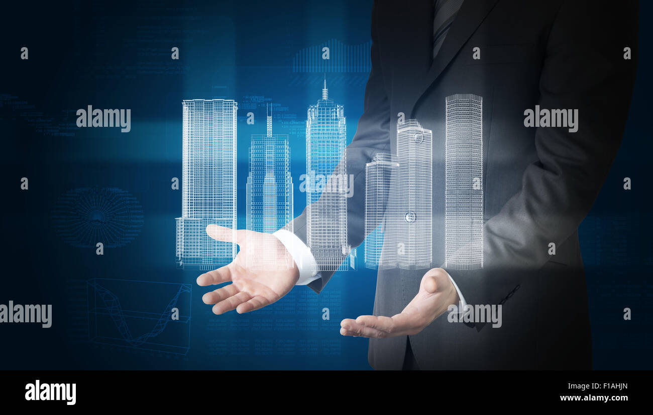 Geschäftsmann mit 3d Stadtmodell und Grafiken Stockfoto