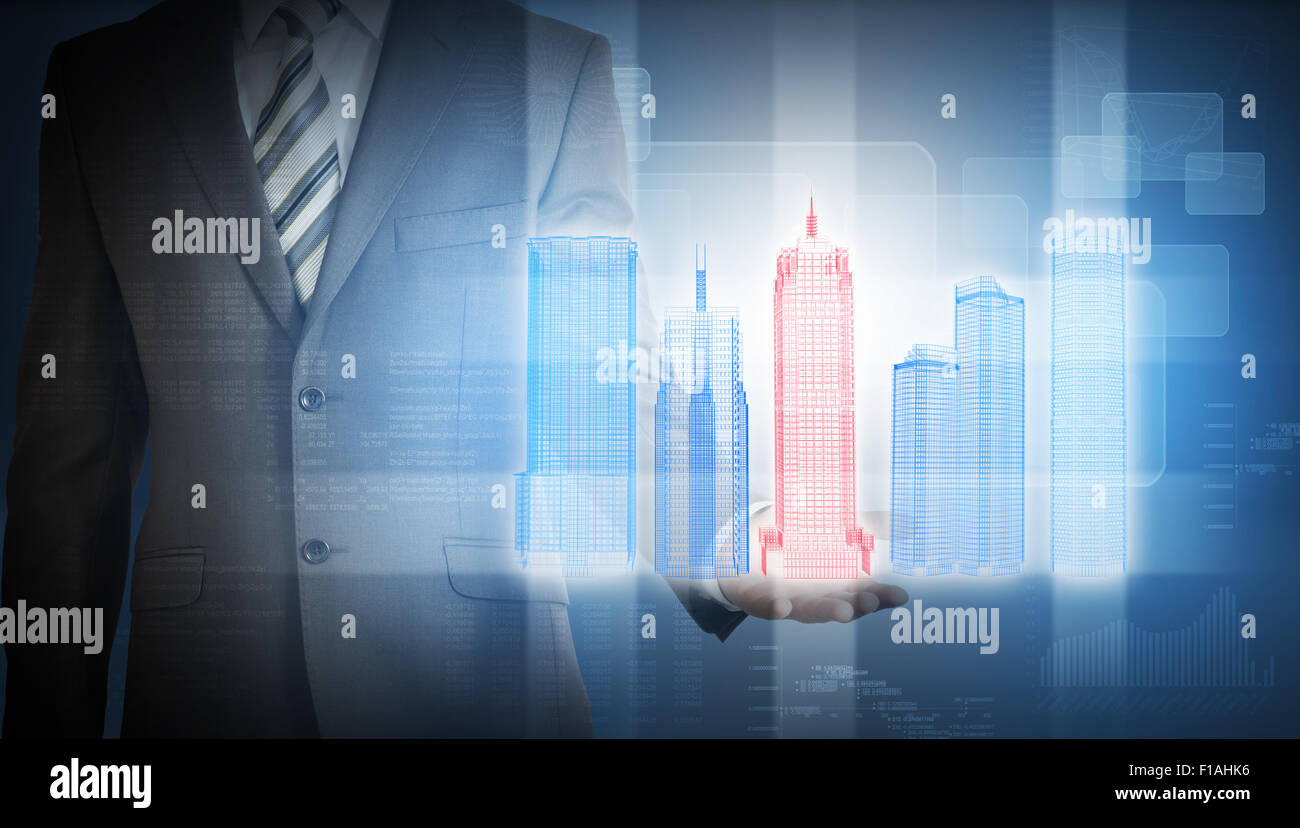 Geschäftsmann mit bunten 3d Stadtmodell und Grafiken Stockfoto