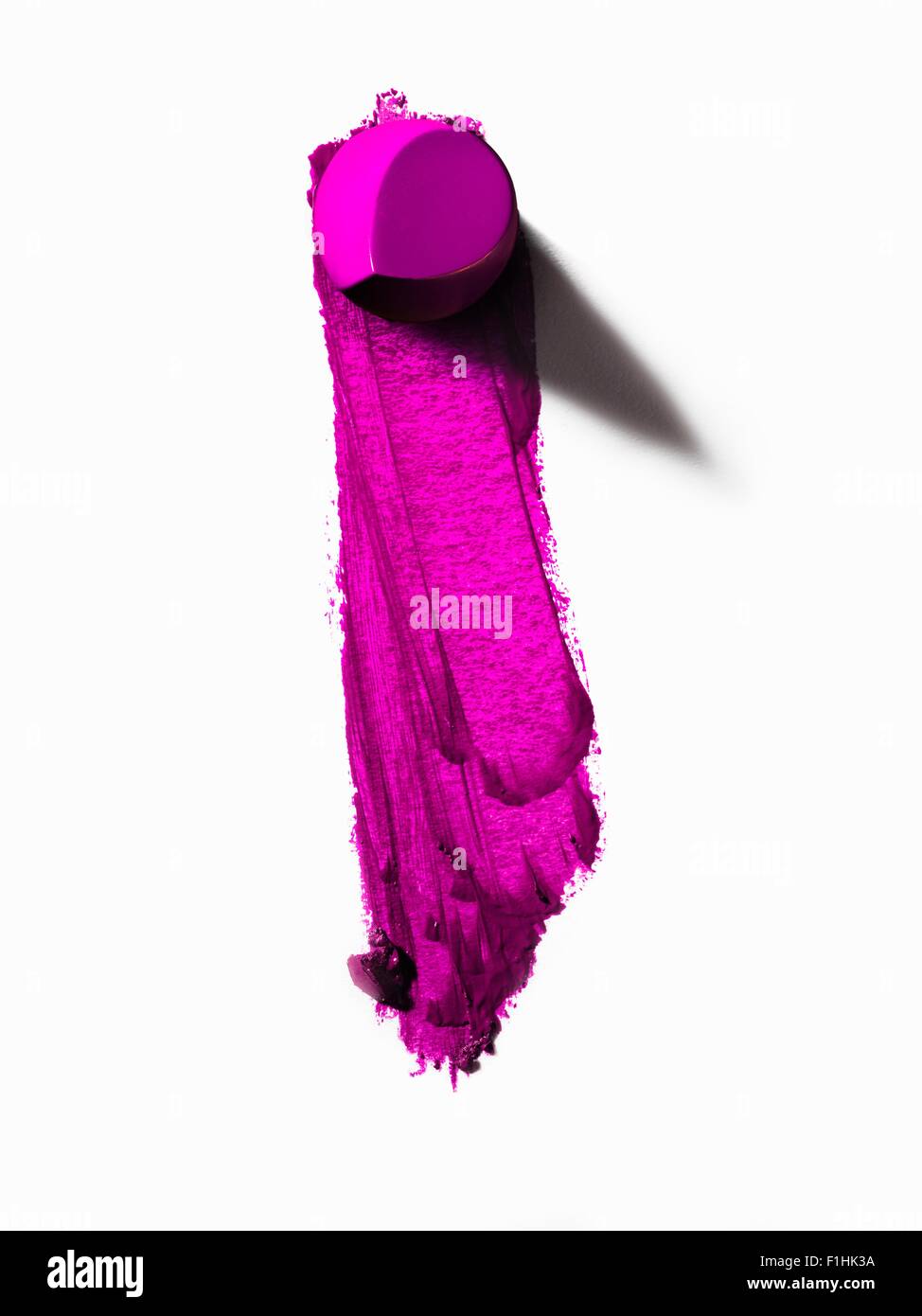 Auszug aus Stück rosa Lippenstift und verschmierte Linie Stockfoto