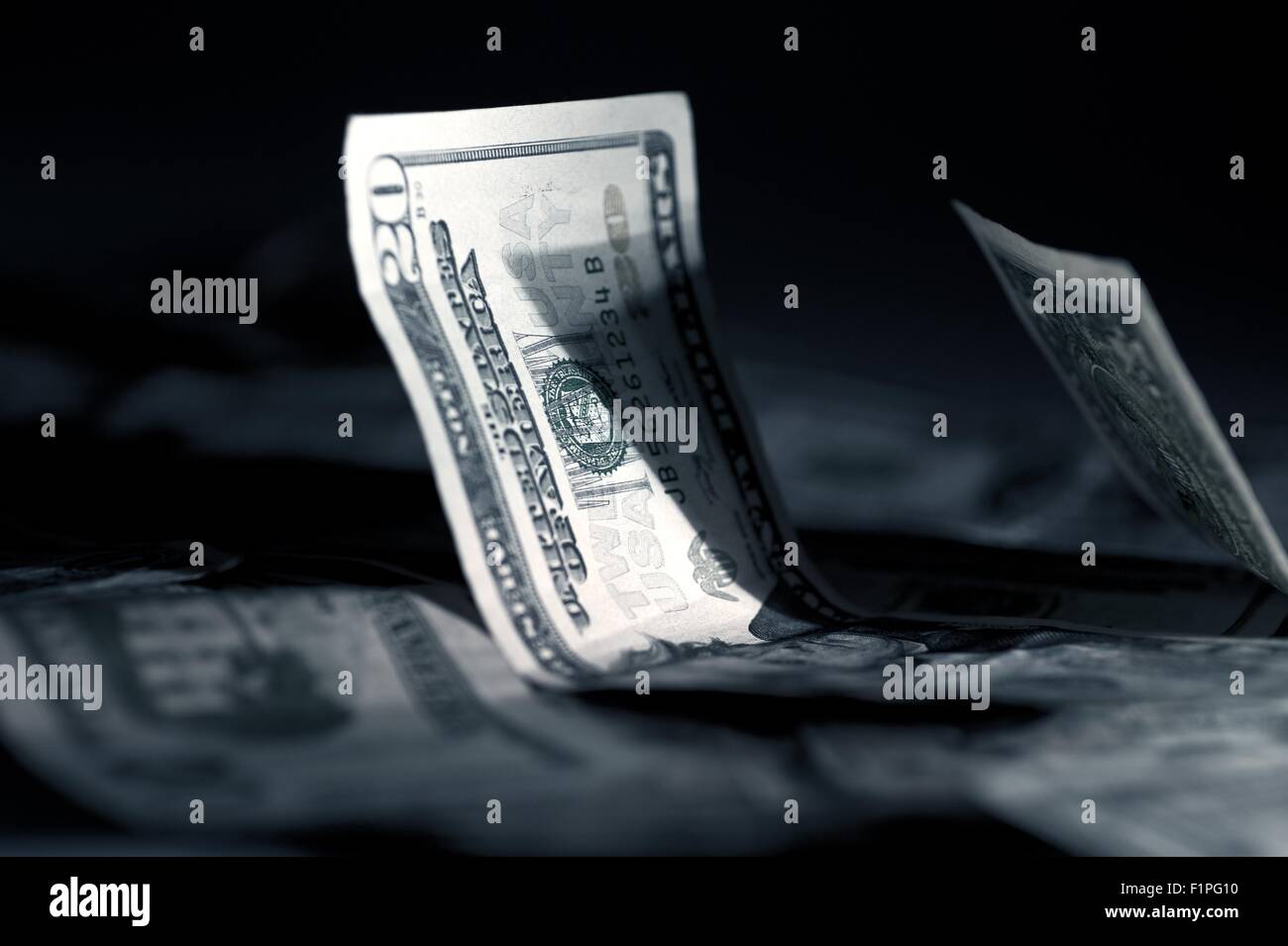 US-Dollar in dunklen Studiofotografie. Geschäft / Geld-Thema. Stockfoto