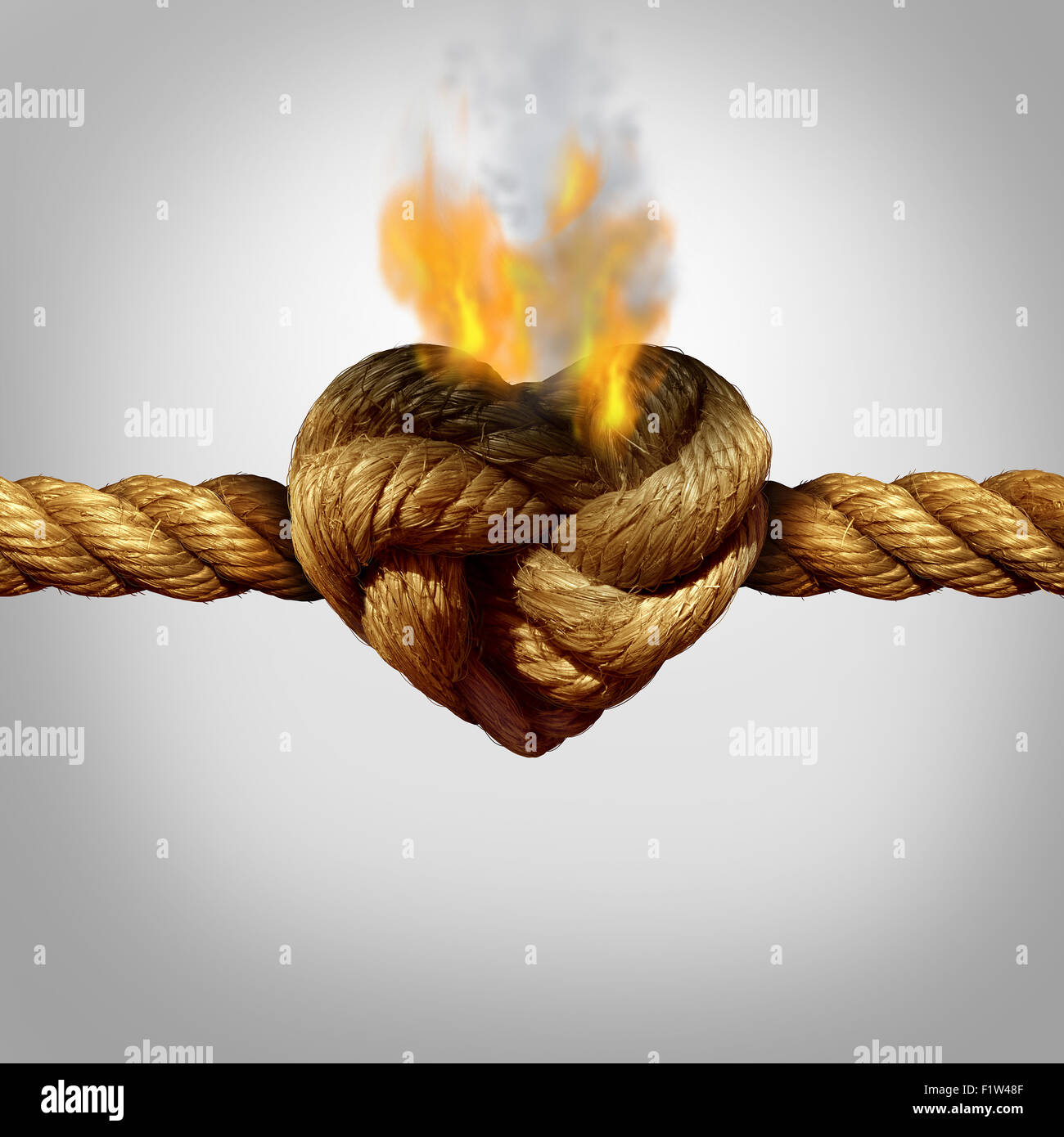 Scheidung und Trennung-Konzept als ein Seil mit einem brennenden Knoten geformt wie ein Herz der Liebe als Beziehung Problem Symbol oder infideli Stockfoto