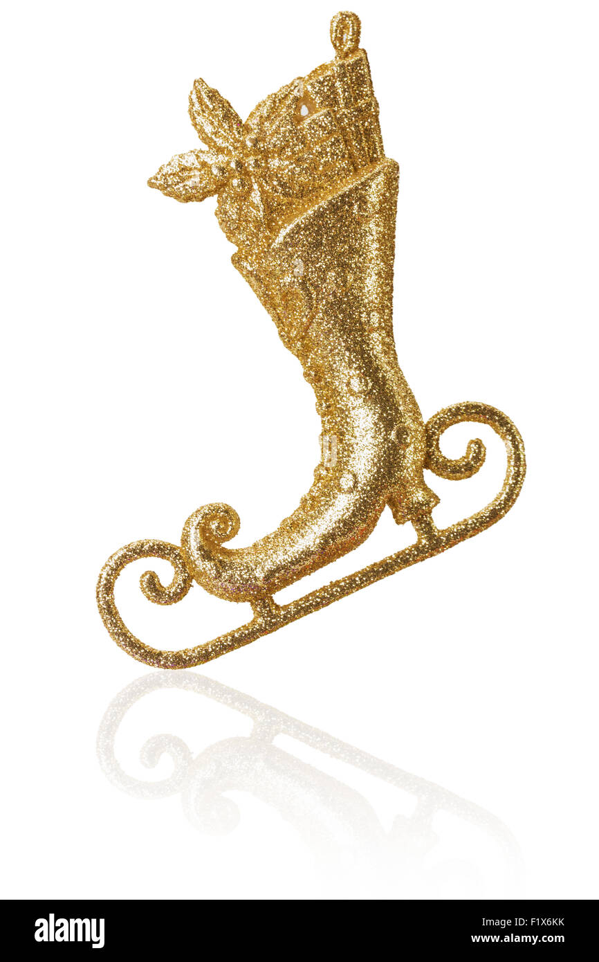 Goldene Miniatur Skate auf dem weißen Hintergrund isoliert. Stockfoto