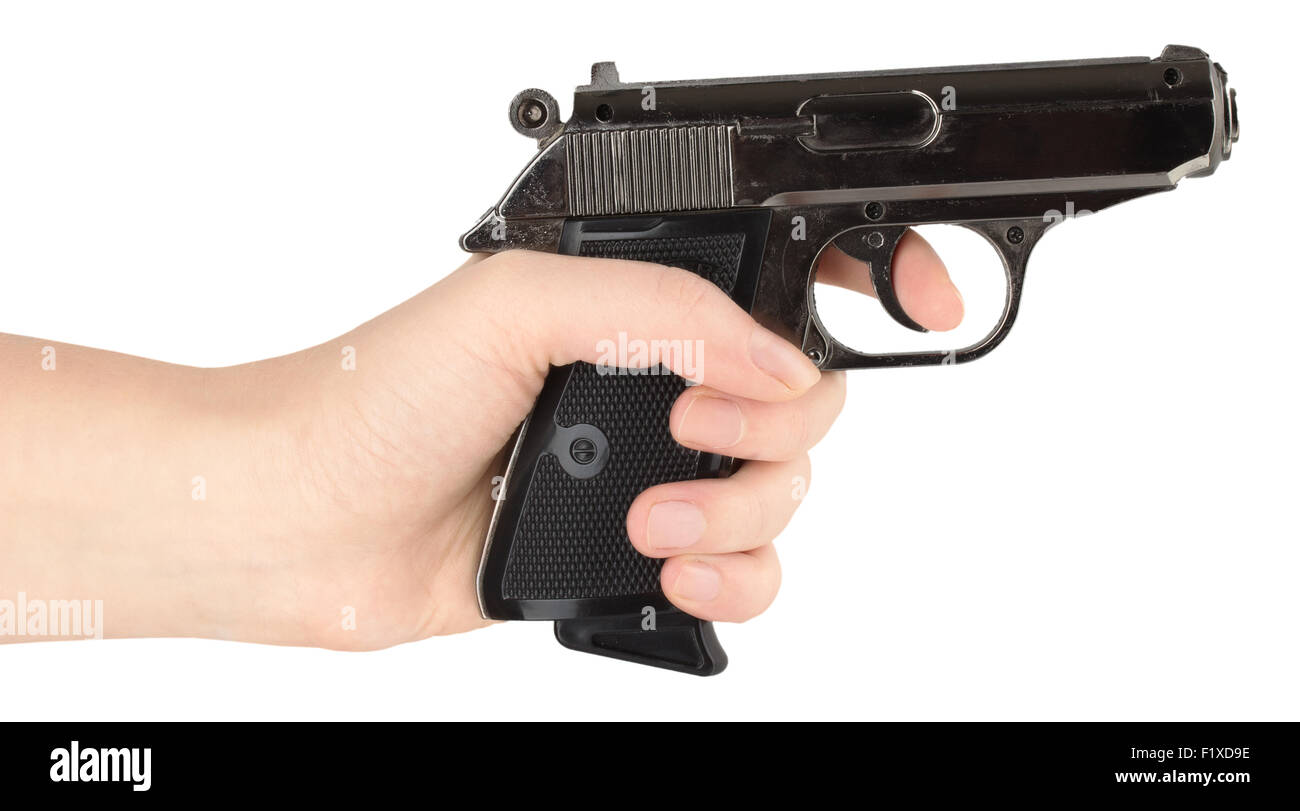 Hand hält eine Pistole auf weißem Hintergrund Stockfoto