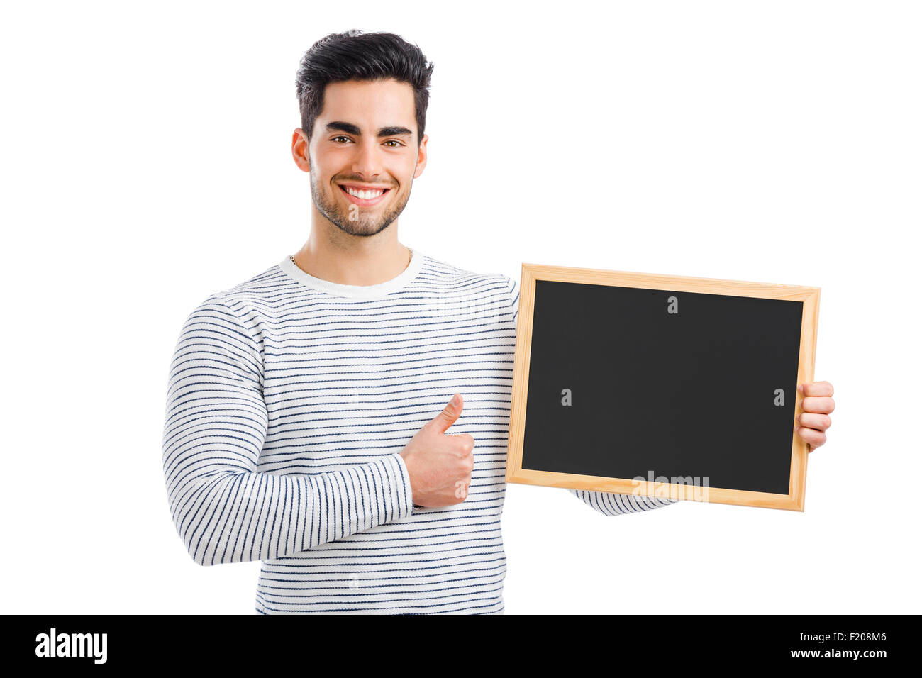 Hübscher junger Mann halten und deutete auf eine kleine Tafel, auf einem weißen Hintergrund isoliert Stockfoto