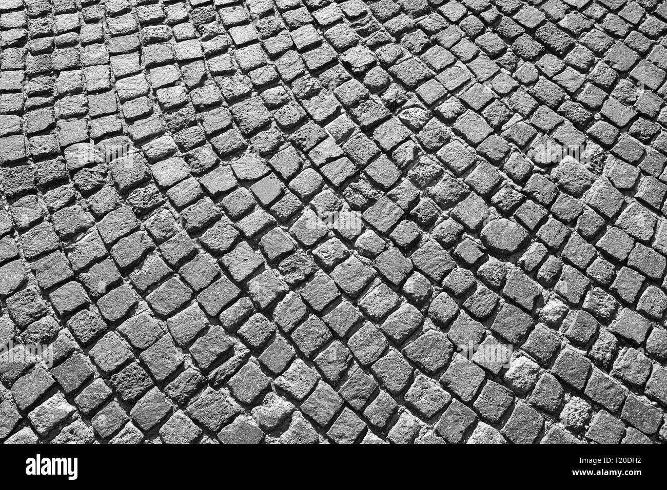 Kopfsteinpflaster Straße grauen Granit mit runden Muster. Hintergrundtextur Foto Stockfoto