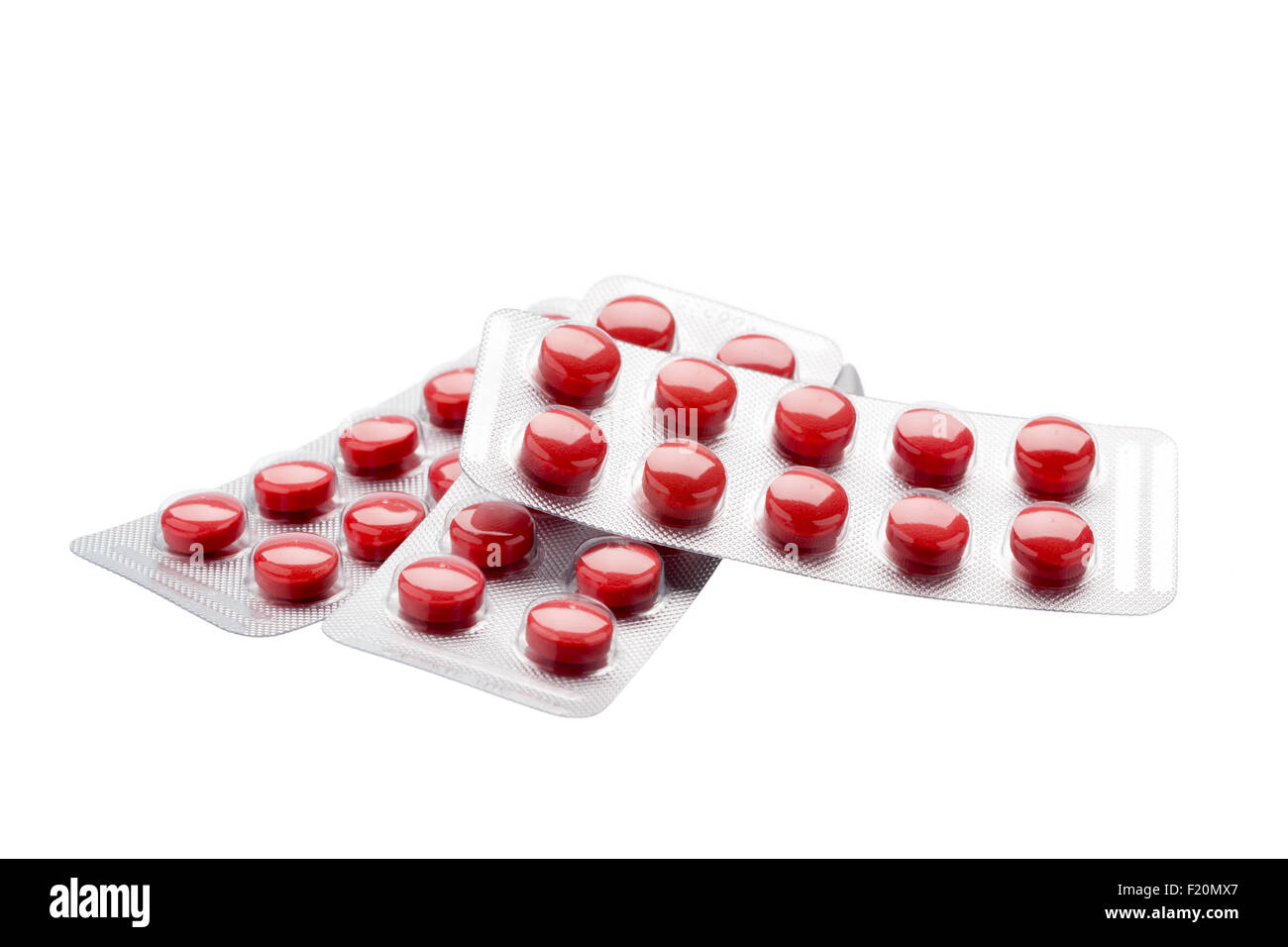 Isolierten roten Pillen in Folie Blisterpackung auf weißem Hintergrund Stockfoto
