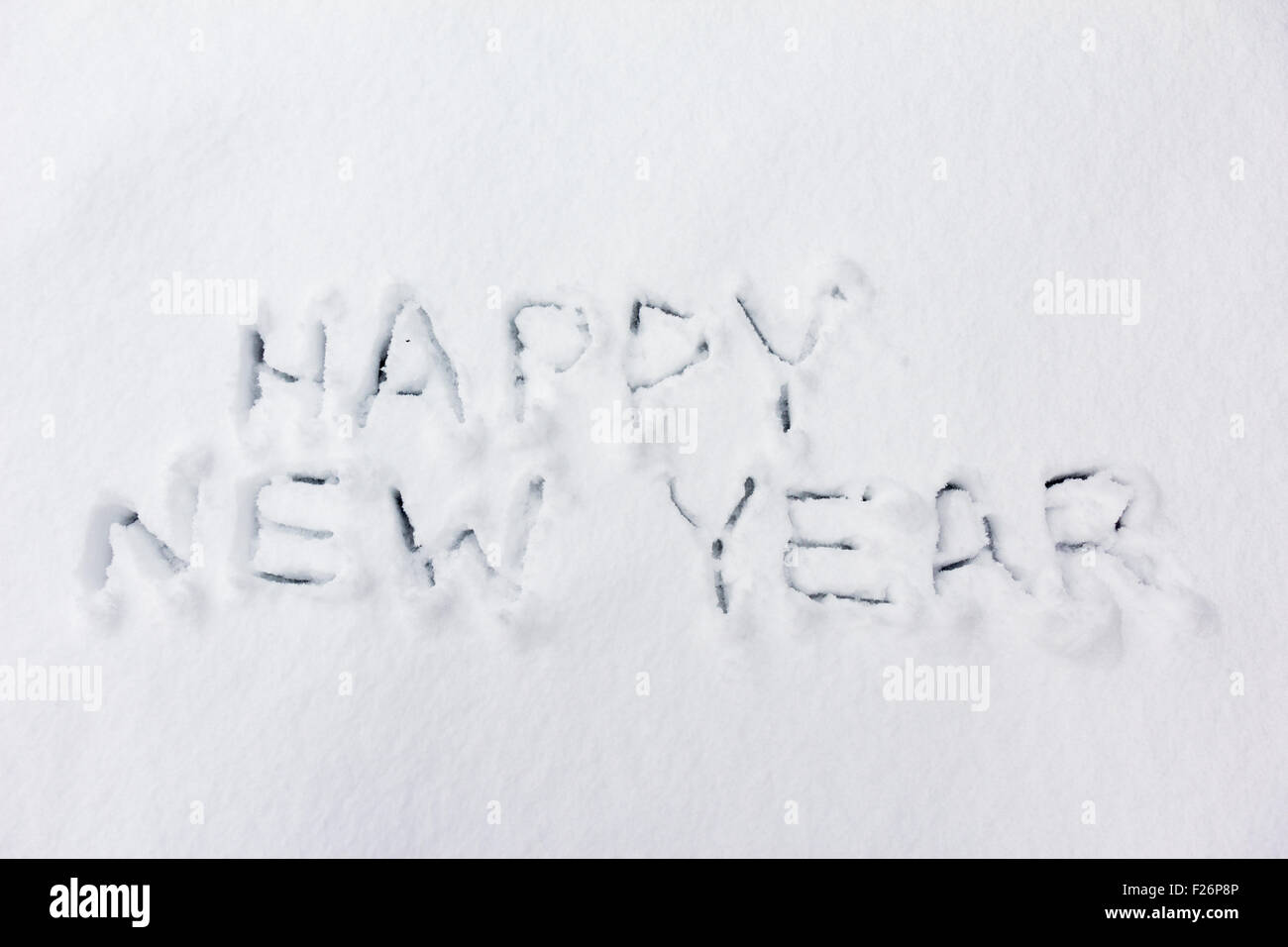 Frohes neues Jahr handschriftlichen Text auf Schnee Stockfoto