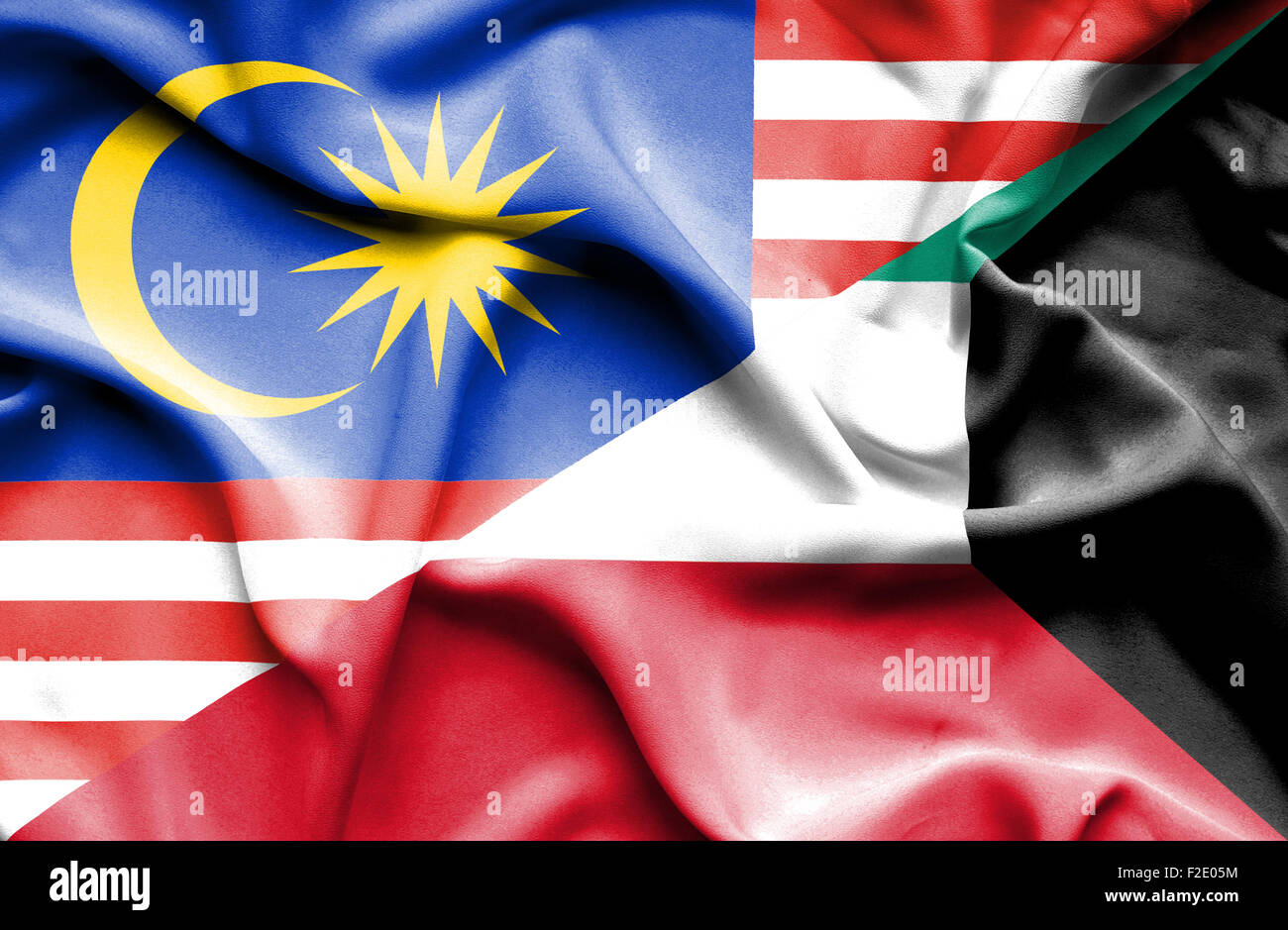 Wehende Flagge von Kuwait und Malaysia Stockfoto