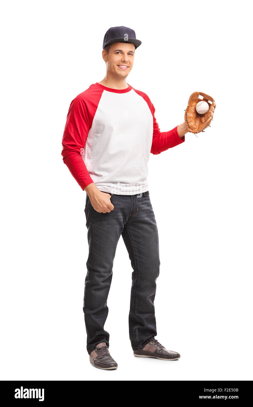 In voller Länge Portrait eines jungen Mannes hält einen Baseball und schaut in die Kamera, die isoliert auf weißem Hintergrund Stockfoto
