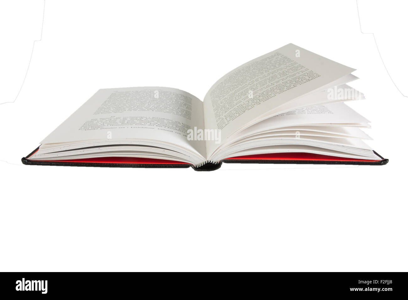 Ein offenes Buch liegt auf weißem Hintergrund, 100 % isoliert und leicht zu extrahieren aus dem Hintergrund Stockfoto