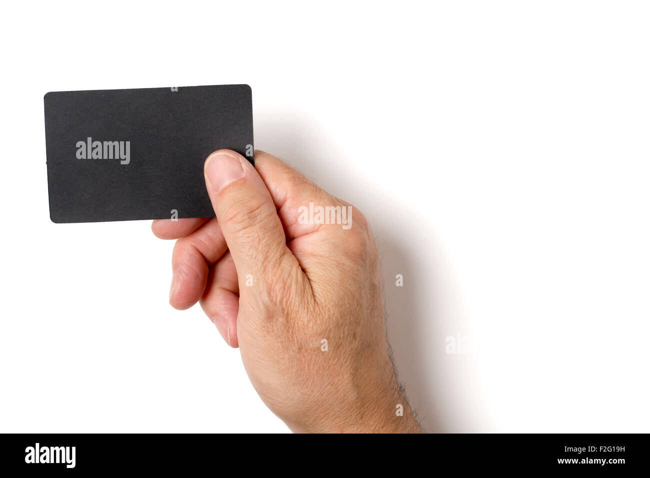 Nahaufnahme des Mannes Hand, die leere schwarze Karte. Studio gedreht isoliert auf weiss. Stockfoto
