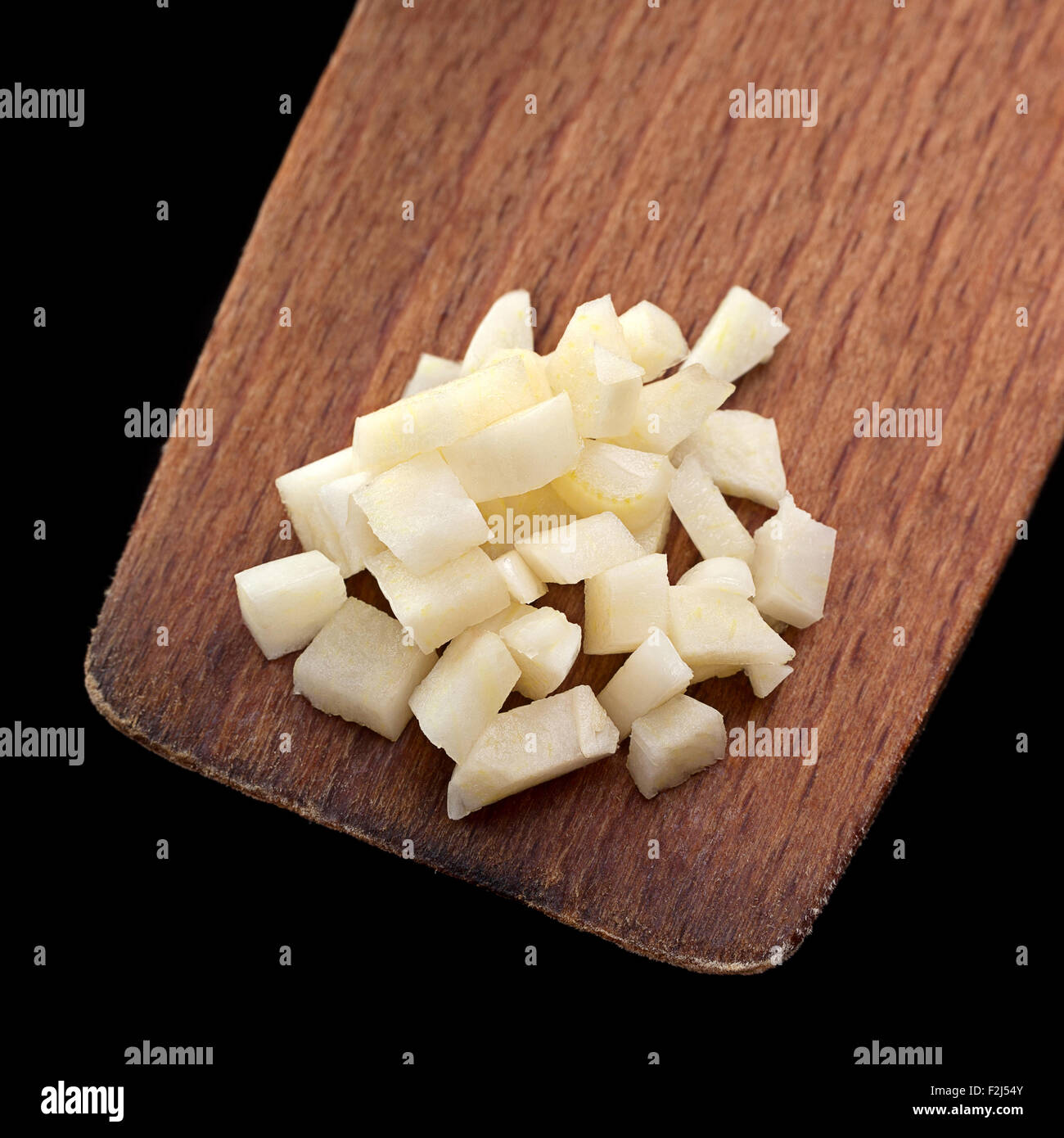 Gehackten Knoblauch Gemüse Closeup auf Holz Löffel Stockfoto