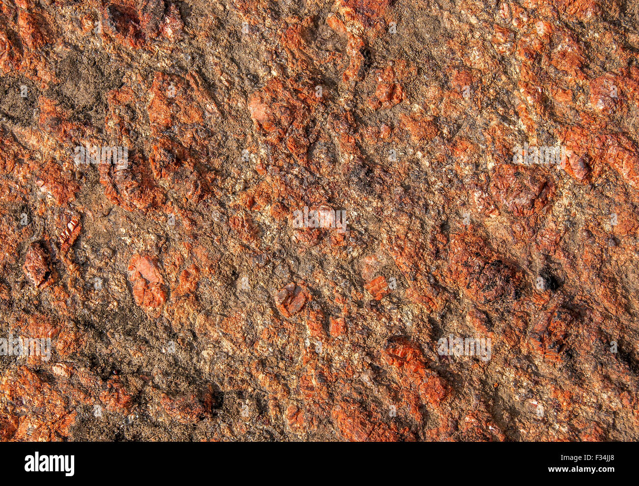 Zusammenfassung Hintergrund aus rotem Granit mit rauher Oberfläche Stockfoto