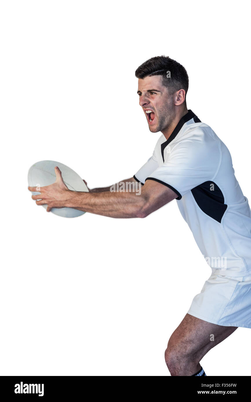 Mann hält Rugby-Ball und schreien Stockfoto