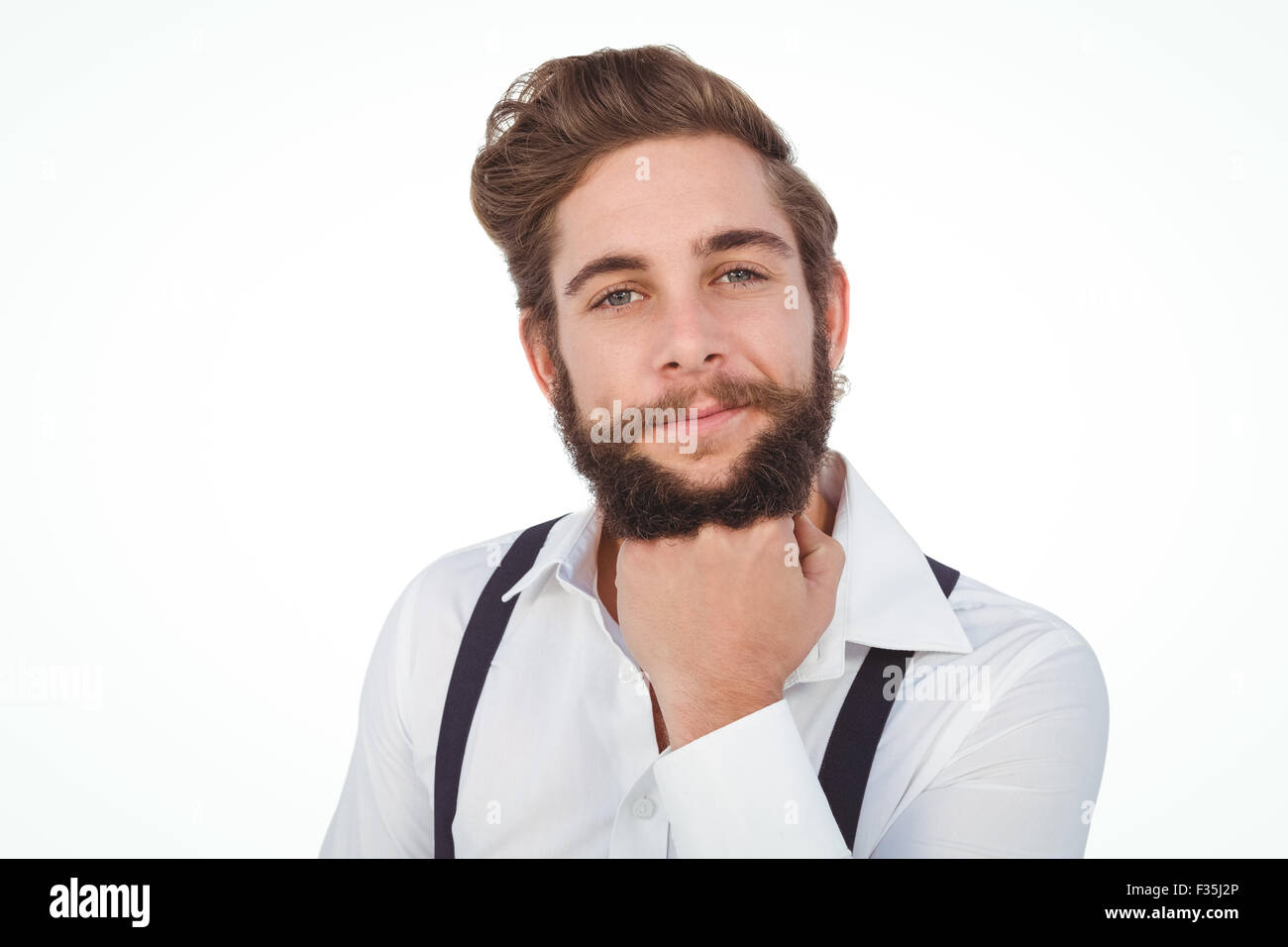 Zuversichtlich Hipster mit Hand am Kinn Stockfoto
