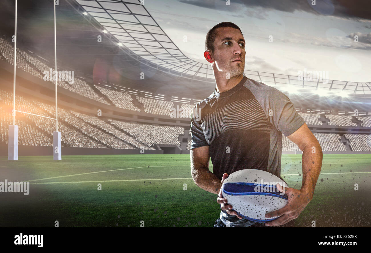 Zusammengesetztes Bild des nüchternen Rugby-Spieler mit ball Stockfoto