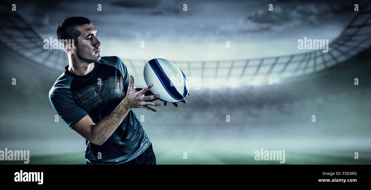 Zusammengesetztes Bild von Sport-Spieler den Ball fängt Stockfoto