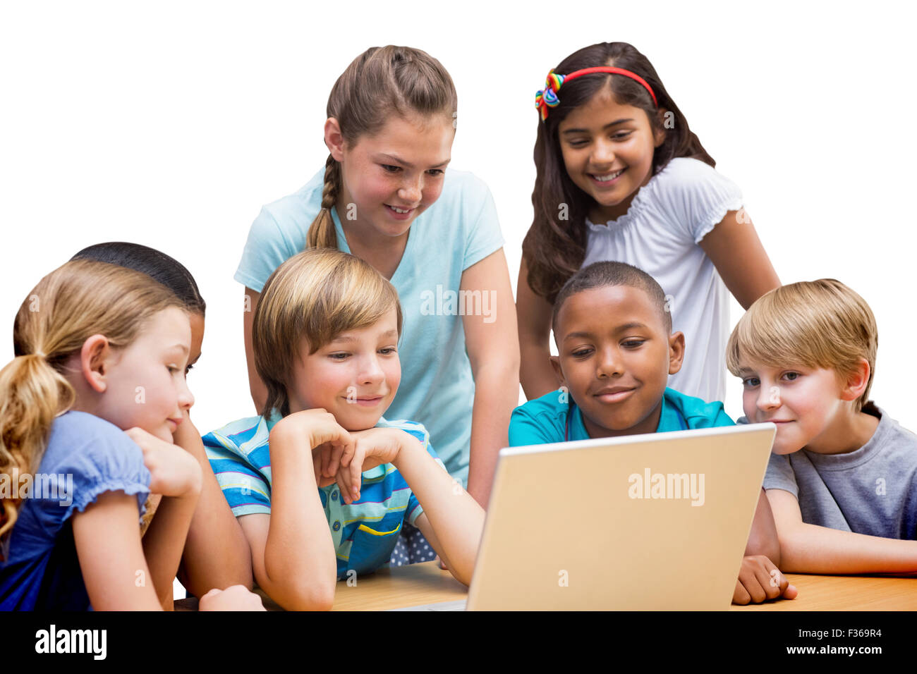 Zusammengesetztes Bild der niedlichen Schülerinnen und Schüler mit Tablet-PC in der Bibliothek Stockfoto