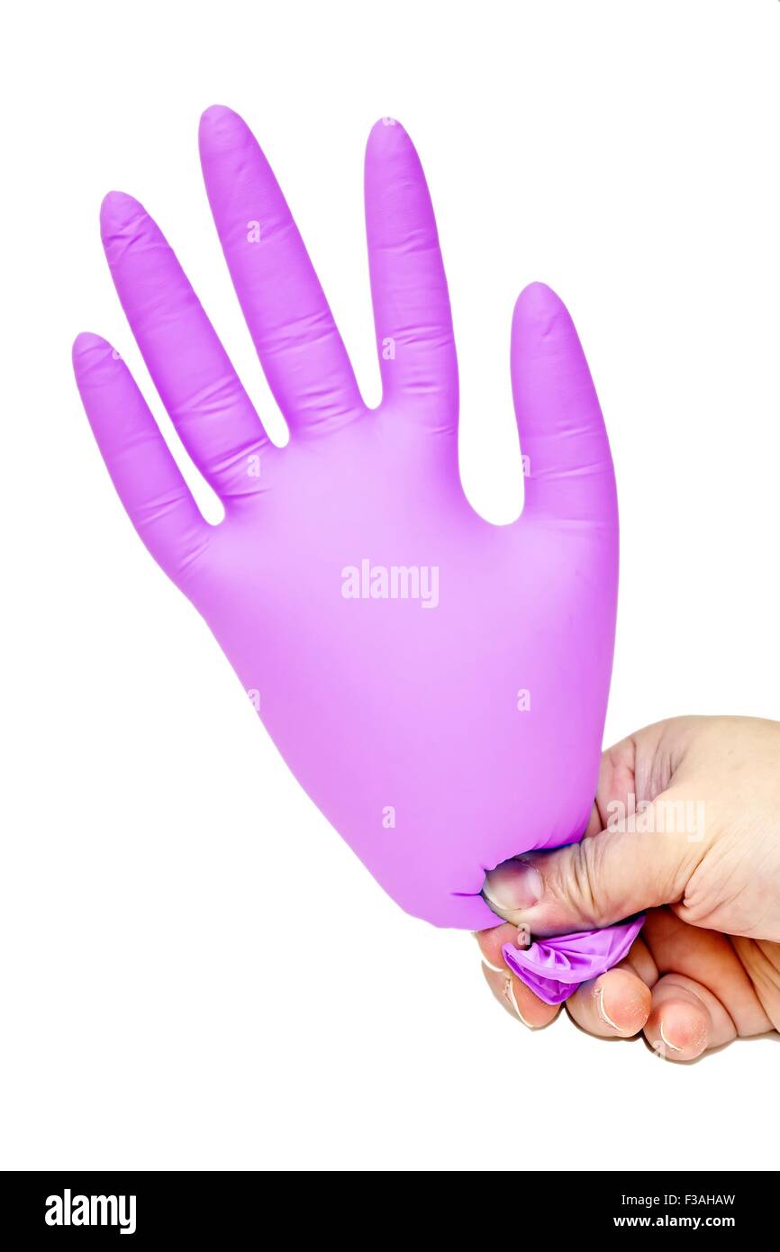 Hand, die Latex-Handschuh Pink gesprengt Stockfoto
