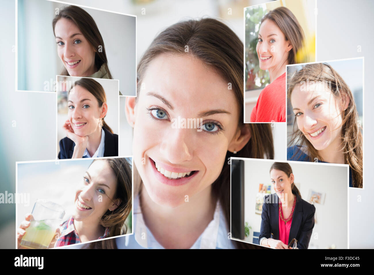 Zusammengesetztes Bild der Frau mit ihren Fotografien umgeben Stockfoto