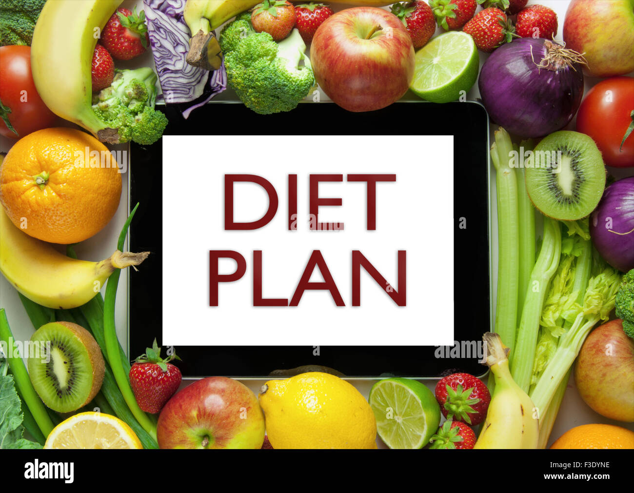 Obst und Gemüse auf einem Computer Tablet-Diät-plan Stockfoto