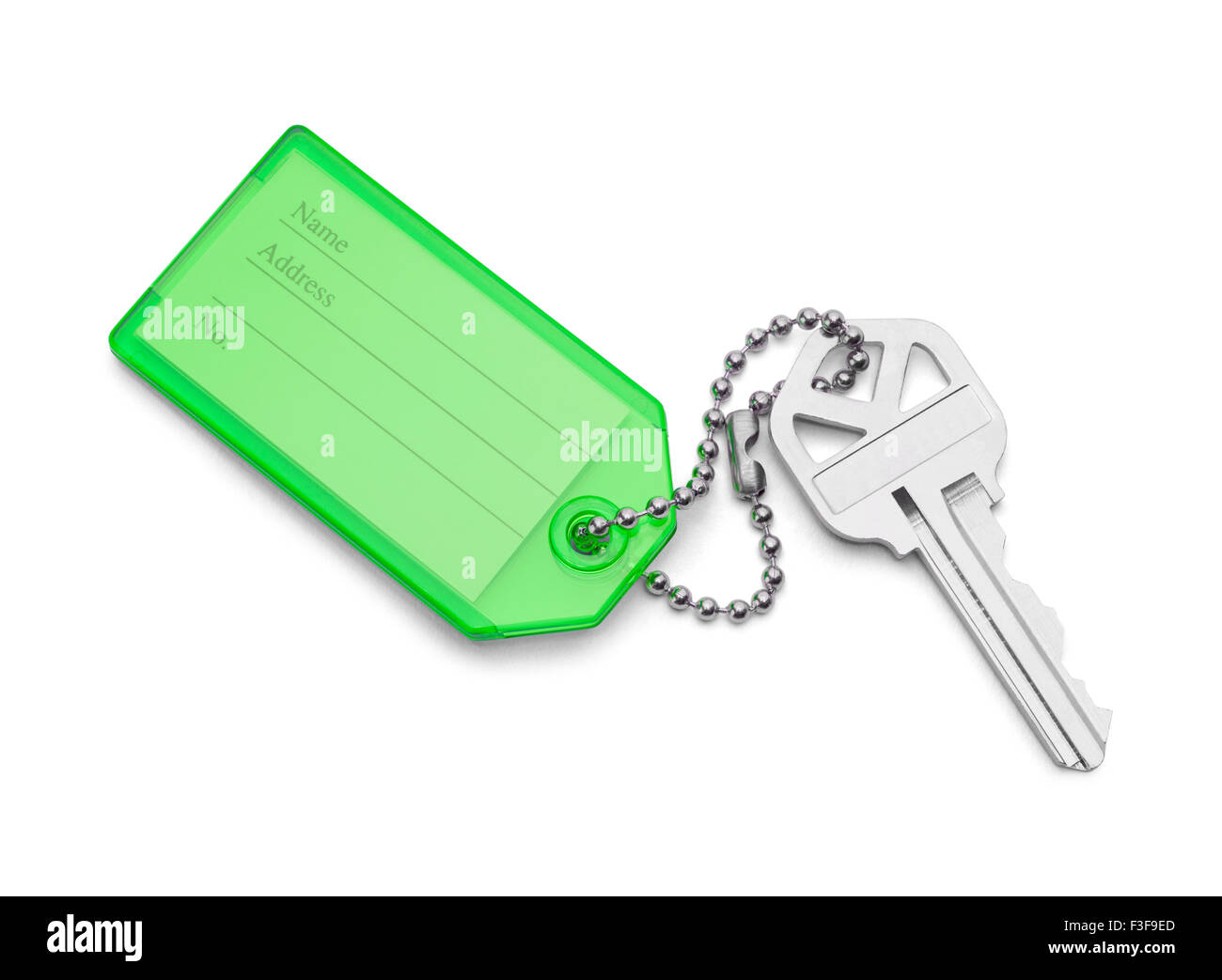 Hausschlüssel mit Namensschild, Isolated on White Background. Stockfoto