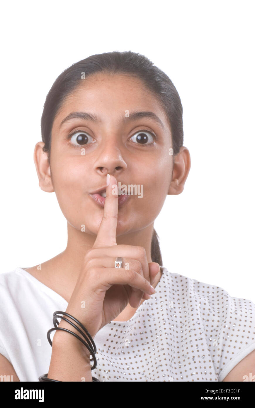Teenager Mädchen hielt Zeigefinger auf Mund halten Stille Herr #733 anzeigen Stockfoto