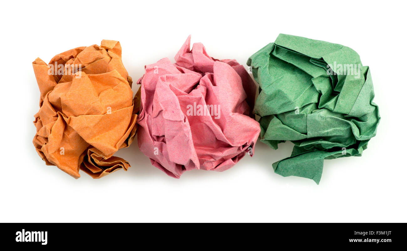 Orange, Pink und grün zerknittert gefaltetes Papierkugeln Stockfoto