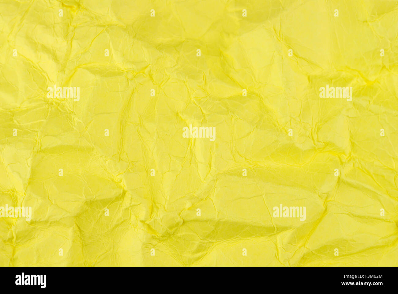 Gelbe zerknittertes Papier Hintergrundtextur Stockfoto
