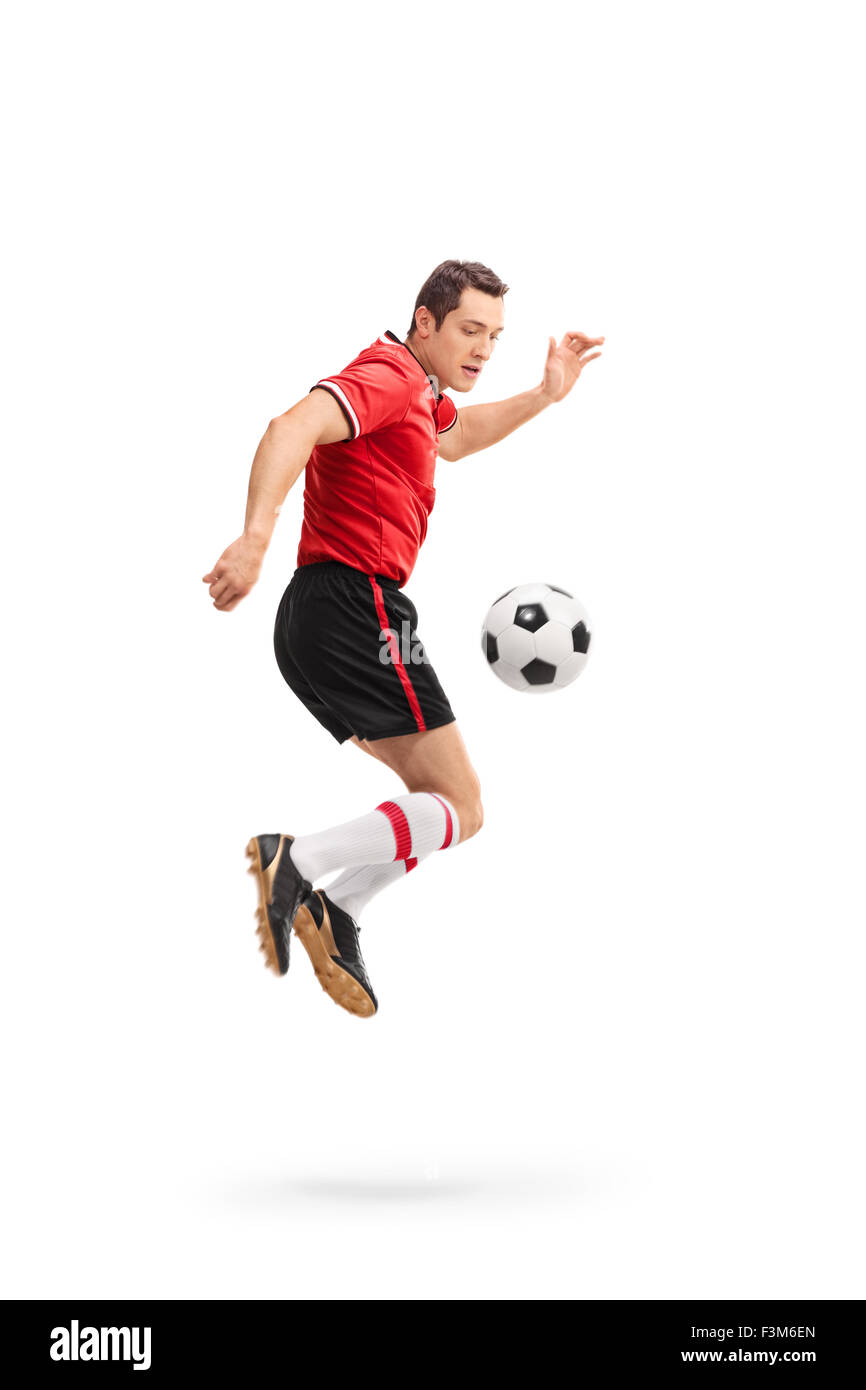 Voller Länge Porträt eines jungen männlichen Fußballspielers gedreht in der Luft während der Durchführung Regenbogen Streifen isoliert auf weißem Hintergrund Stockfoto