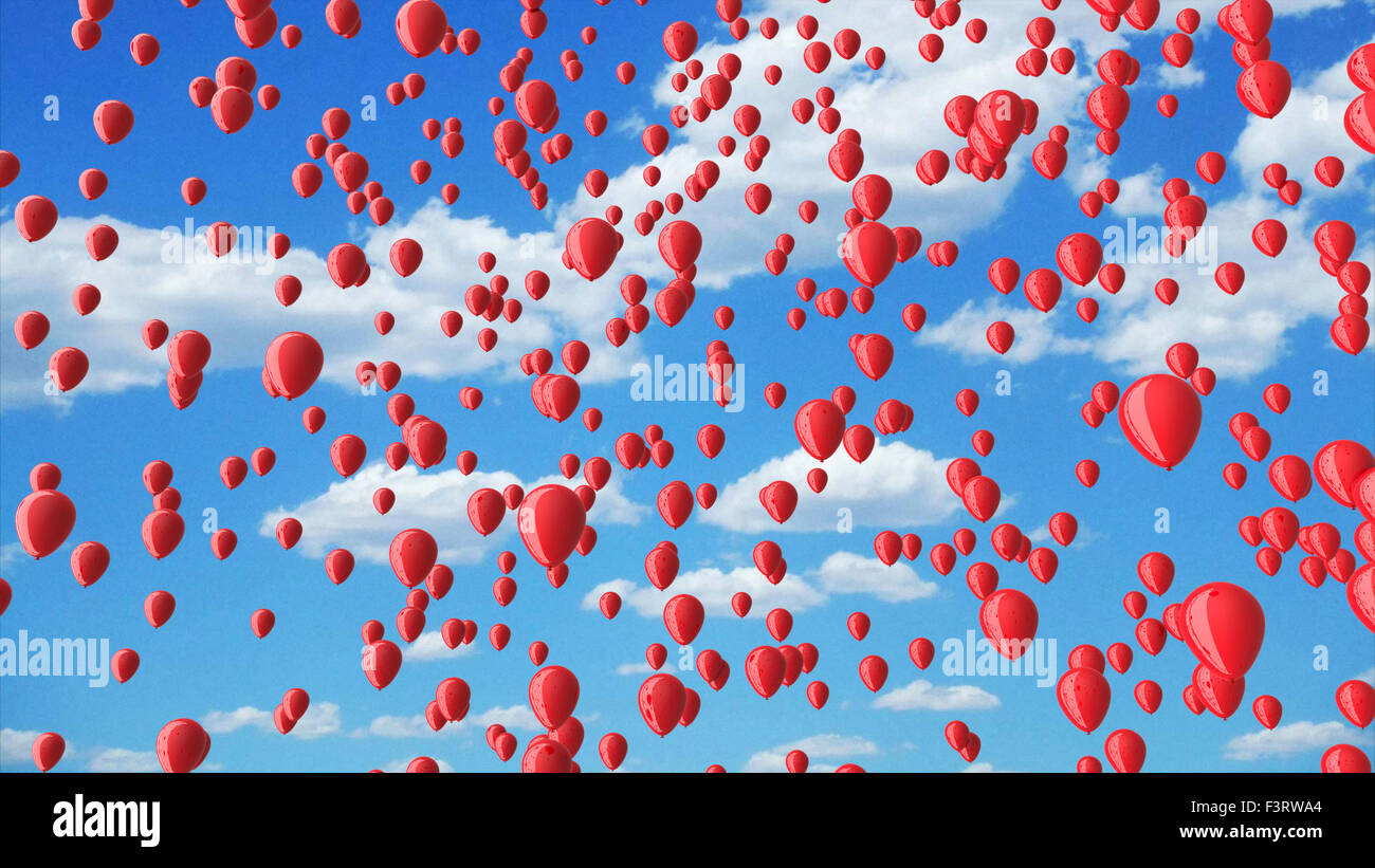 rote Luftballons in den blauen Himmel mit Wolken. Stockfoto