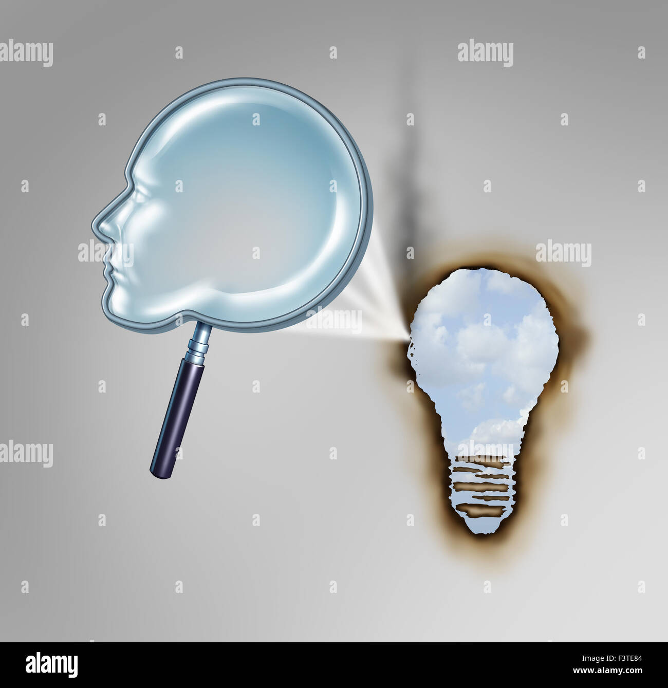 Menschliche Kreativität Konzept wie eine Lupe, geformt wie ein Kopfprofil erstellen einen heißen Strahl von Licht brennen ein Loch im Papier Stockfoto